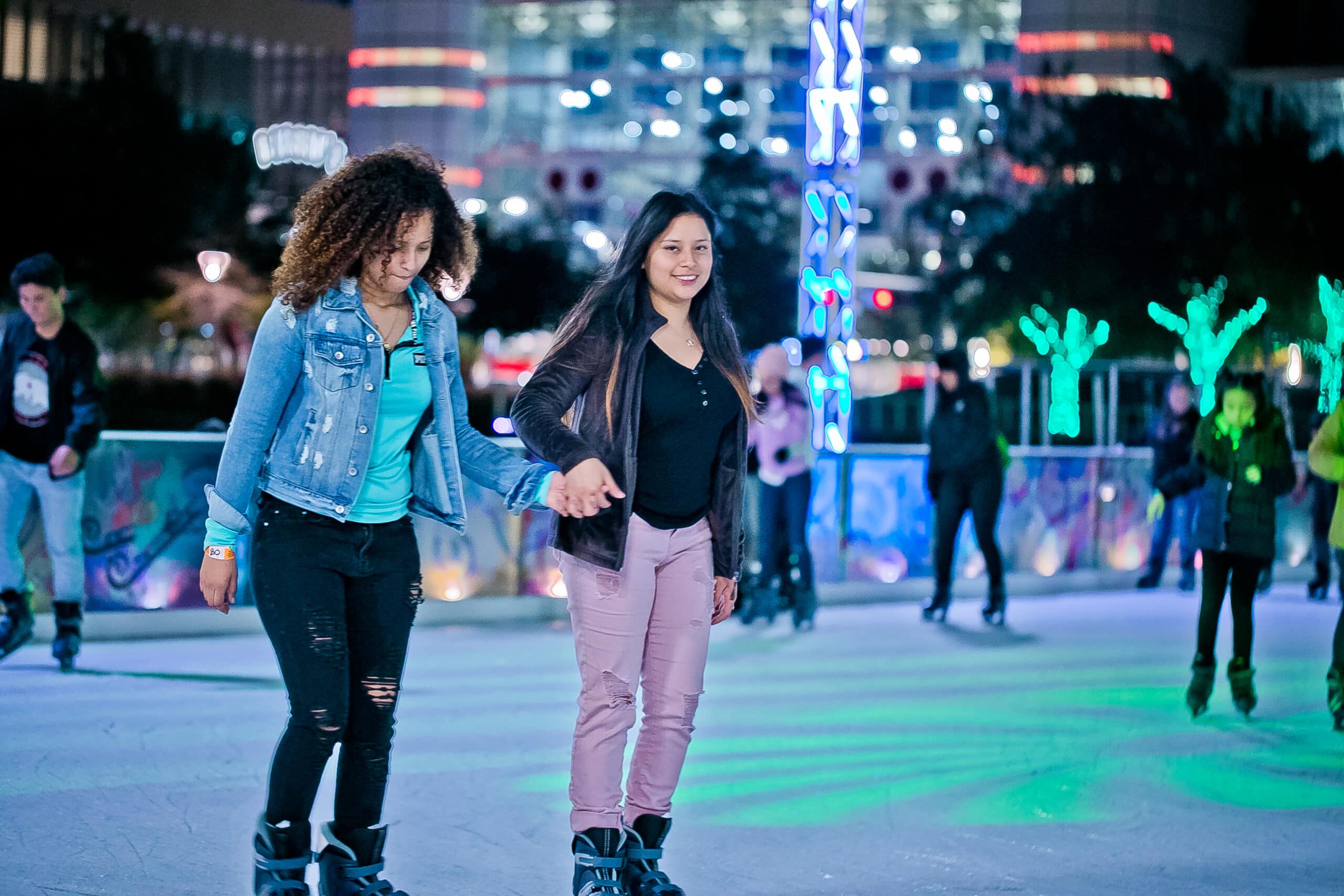 Ice skate at Discovery Green, downtown Houston, two for the price of one.