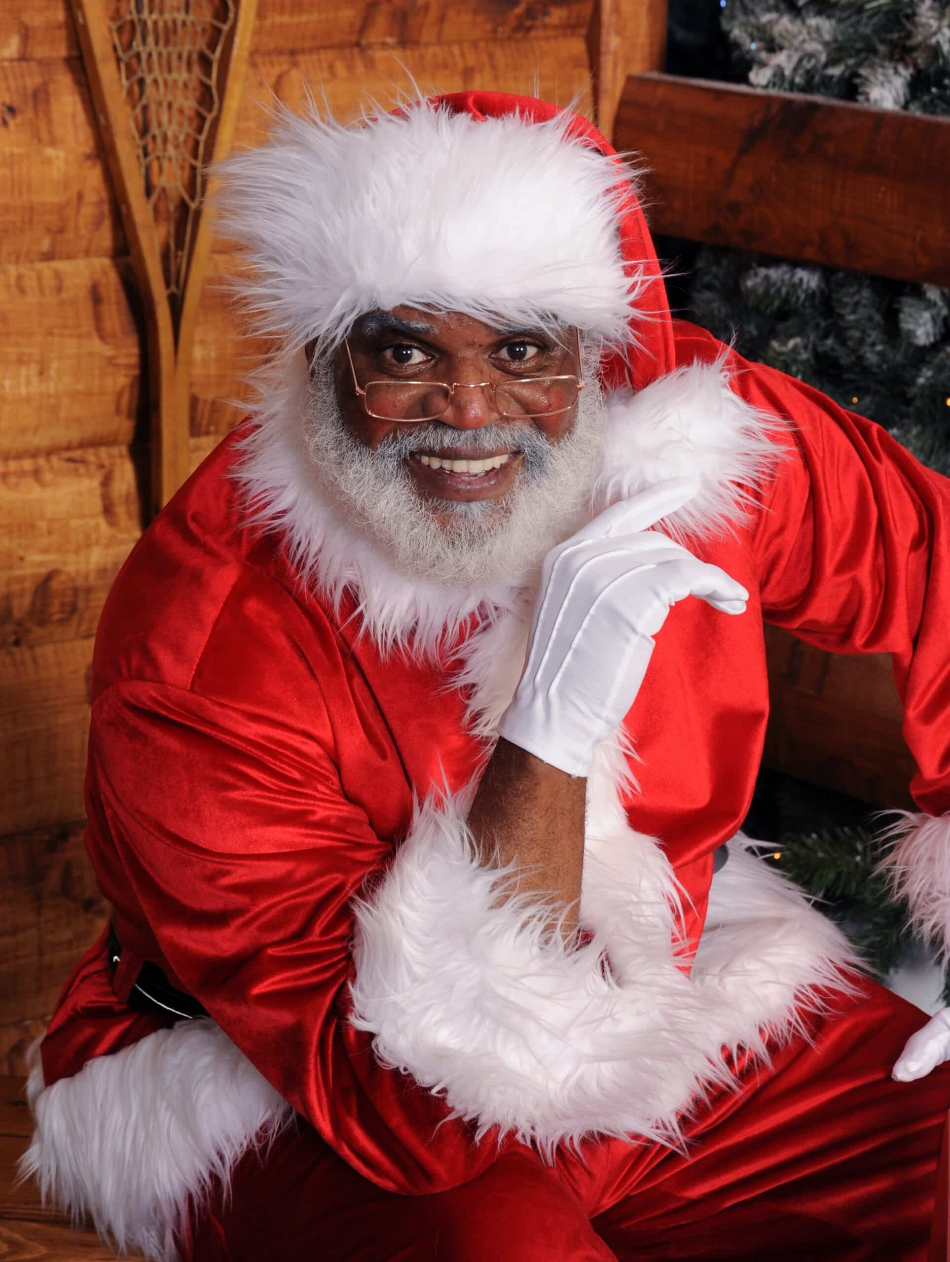 Black Santa poses for a photo